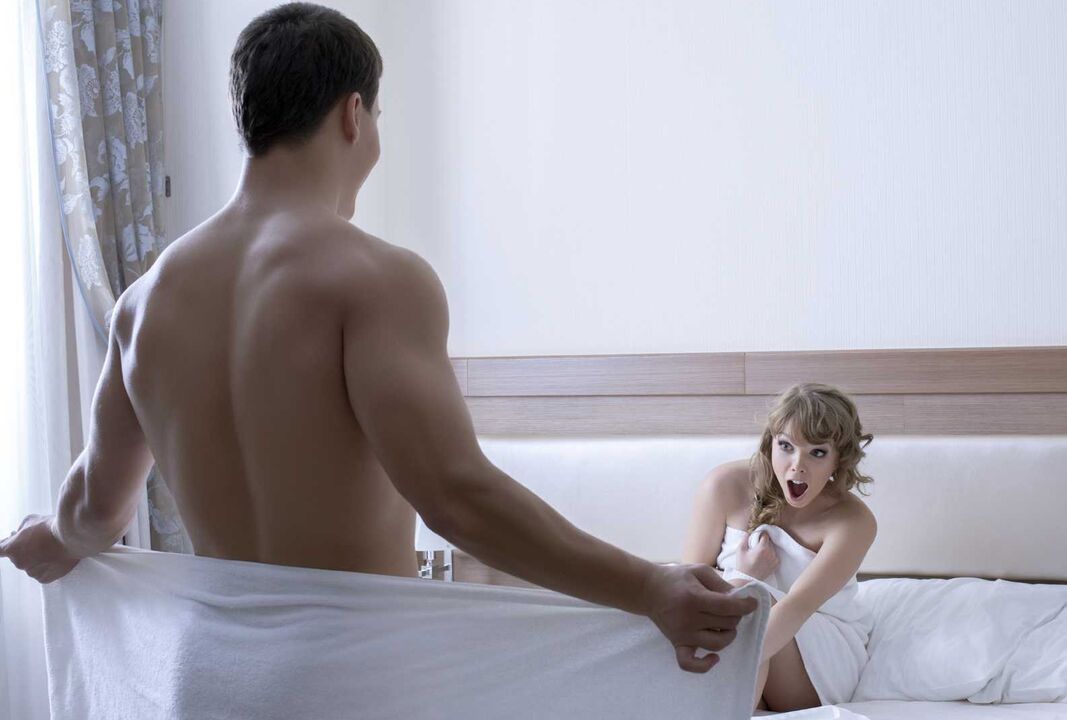 The girl is pleasantly surprised by the size of the young man's penis.